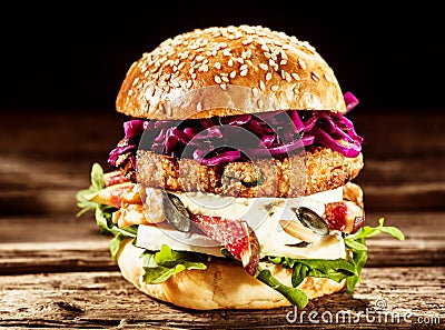 Close Up of Burger Piled High with Fresh Toppings Stock Photo