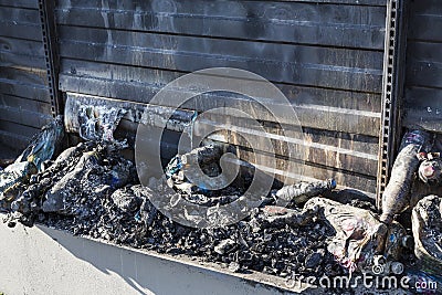 Close up Burned damaged ruins of destroyed supermarket metallic facade arson investigation insurance Stock Photo