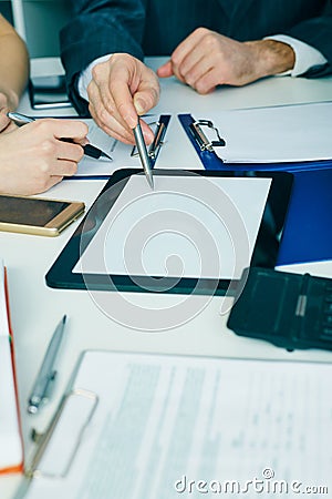 Close-up the business man hand pointing at the tblank tablet screen. Teamwork successful meeting. Stock Photo
