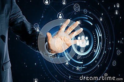 Close up of business man hand using glowing people icons hologram. Creative global structure networking and data exchanges Stock Photo