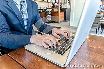 Close-up of business man hands on laptop keyboard. Stock Photo