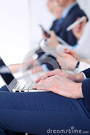 Close-up of business man hands typing on laptop computer at the conference Stock Photo