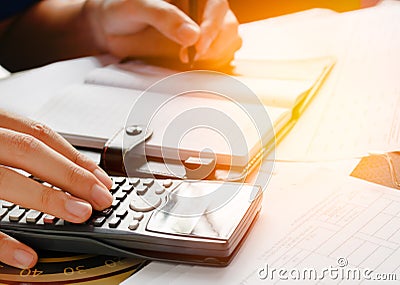 Close up, business man or lawyer accountant working on accounts using a calculator and writing on documents, Stock Photo