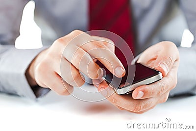 Close up of a business man using a mobile phone Stock Photo