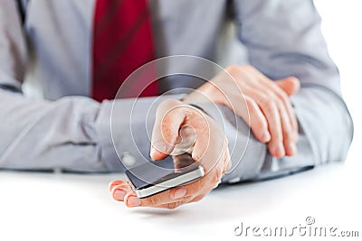 Close up of a business man using a mobile phone Stock Photo