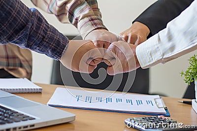 Close-up of business partners making pile of hands at meeting,Team work Stock Photo