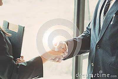 Close up of Business people shaking hands, finishing up meeting, business etiquette, congratulation, merger and acquisition Stock Photo