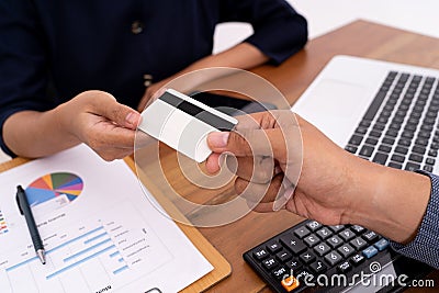 Close up business transactions with his credit card to a customer service. Stock Photo