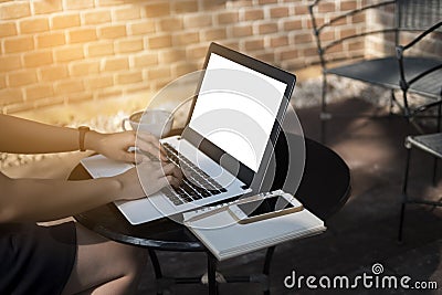 Close-up business woman used laptop to work outdoor, blurred Stock Photo