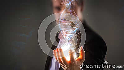 Close up of Businessman holding glowing DNA helix with energy sp Stock Photo