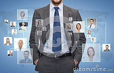 Close up of businessman over icons with contacts Stock Photo