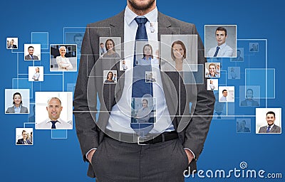 Close up of businessman over icons with contacts Stock Photo