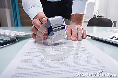 Businessman Stamping Approved On Document Stock Photo