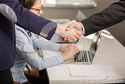 Close up of businessmen and partnership shaking hands for agreement project during board meeting in the office Stock Photo