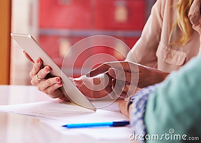 Close Up Of Businesspeople With Digital Tablet In Meeting Stock Photo