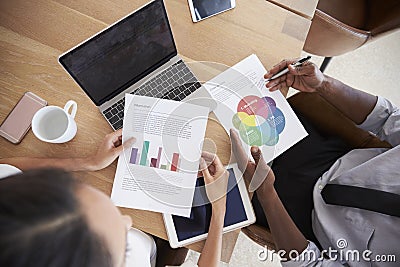 Close Up Of Businesspeople Working On Laptop In Boardroom Stock Photo