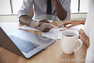 Close Up Of Businesspeople Working On Laptop In Boardroom Stock Photo