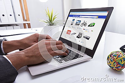 Businessperson Doing Online Shopping On Laptop Stock Photo