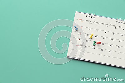 Close up of calendar on the table with green background Stock Photo