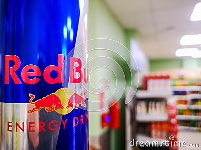 close-up of a can of energy drink with caffeine and taurine Red Bull in a grocery store against the background of a Editorial Stock Photo
