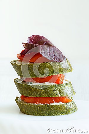 Close-up of canapes with salmon, basil and spinach bread Stock Photo