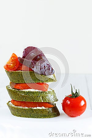 Close-up of canapes with salmon, basil and tomato Stock Photo