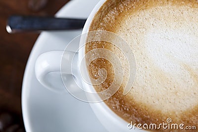 Close-up of a cappuccino coffee cup with milk foam Stock Photo