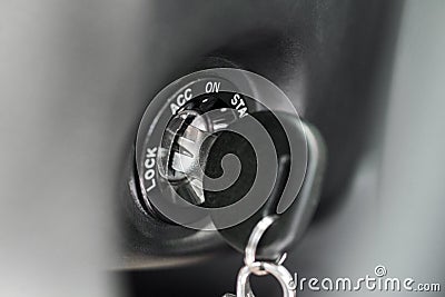 Close up of car key in keyhole for ignition. Car keys in ignition about to start the car. Macro of modern start car key Stock Photo