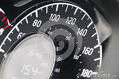 Close-up of car speedometer with digital display showing average speed and time Stock Photo