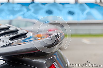 Close up of car spoiler on speedway at stadium Stock Photo