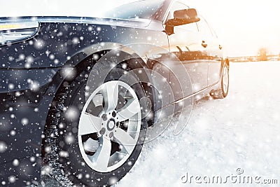 Close up of car tires on the winter road Stock Photo