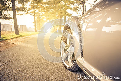 Close up on a car tyre while drifting on a street Stock Photo