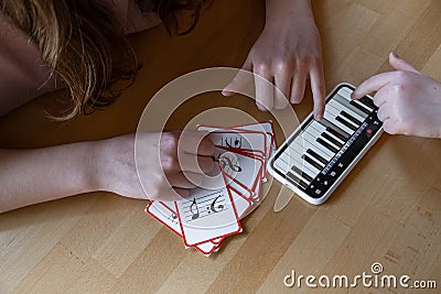 Close-up of cards for studying music and piano in the phone Stock Photo