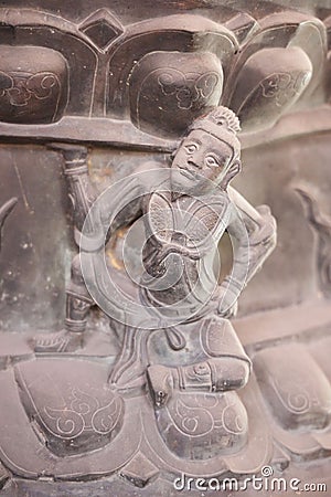 Close-up of a carefully carved statue on the walls of the Beijing Wanshou Temple Editorial Stock Photo