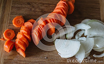 Close up on carot and onion on wooden background Stock Photo