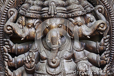 A close up of a carved wodden Ganesha with many details Stock Photo