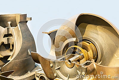 close up cast brass impeller and detail inside volute chamber of cross section industrial centrifugal pump Stock Photo