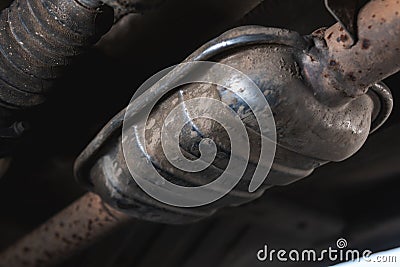 Close-up of Catalytic Converter in Car Exhaust System. The concept of preserving ecology, reducing harmful emissions into the air Stock Photo