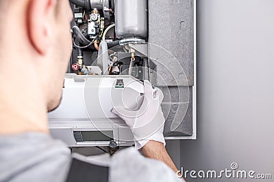 Contractor Repairing Central Heating Furnace System Stock Photo