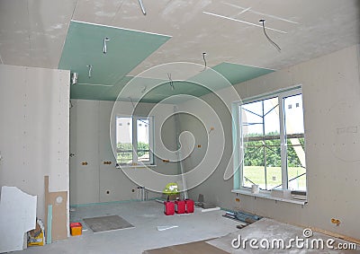 Close up on ceiling construction details with electricity wire. Building construction gypsum plaster walls and ceiling. Ceiling Jo Stock Photo