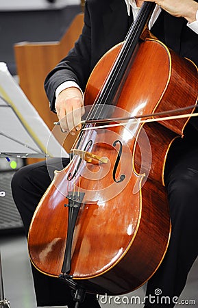 Close up of a cellist playing a cello Stock Photo