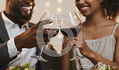 Close up of african couple toasting with red wine Stock Photo
