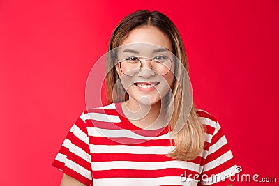 Close-up cheerful asian blond girl wear glasses smiling pleasant, give friendly toothy grin camera talking casually Stock Photo