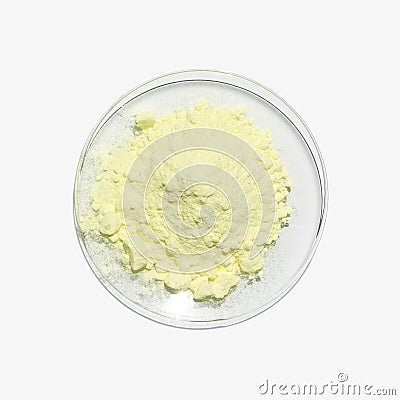 Close up chemical ingredient on white laboratory table. Sulfur Powder in Chemical Watch Glass. Top View Stock Photo