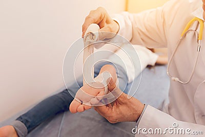 Close up of child foot that being in competent hand Stock Photo