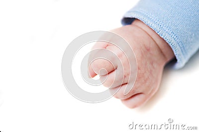 Close up of a child`s fist on white background. Clenched fist - hand of child, baby power. New born baby hand Stock Photo