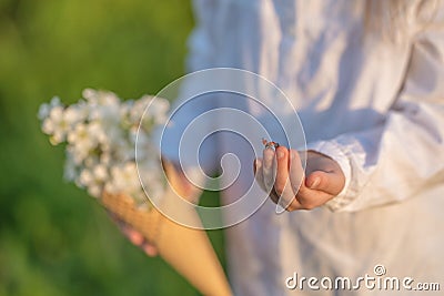Close-up of a child`s hand with ladybug crawling over it and about to take off Stock Photo