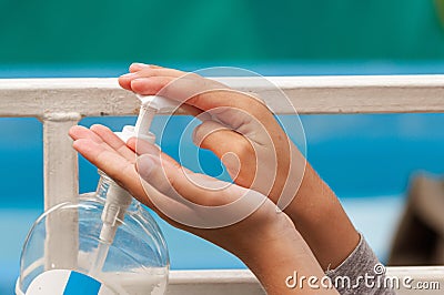 Close-up of children`s hands squeezing sanitizer Stock Photo