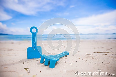 Close-up of children's toys on a white beach Stock Photo