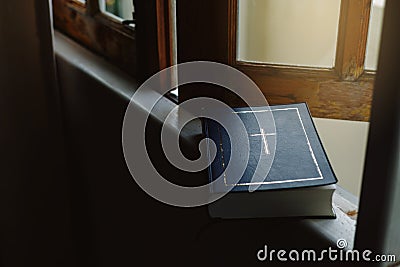 Close up christian holy Bible Placed by the window Stock Photo